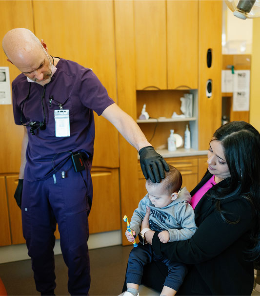 Dentist with child and mother