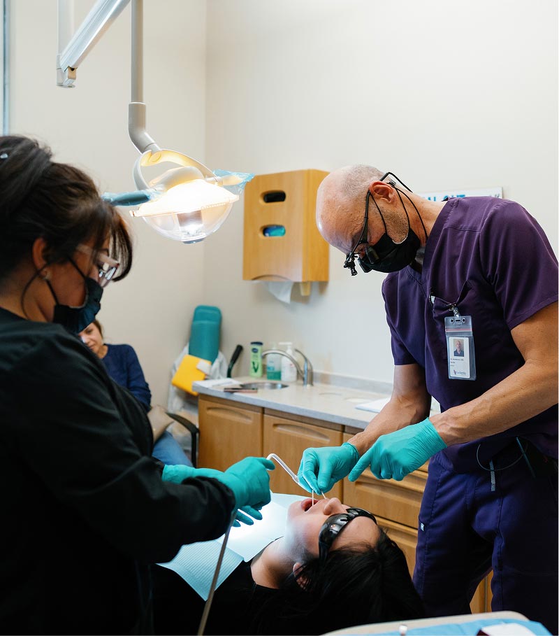Dentist with patient at La Familia Health Dental Clinic in Santa Fe