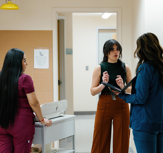 La Familia Health staff talking