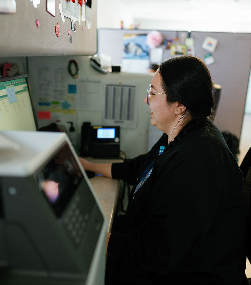 La Familia Staff member at desk