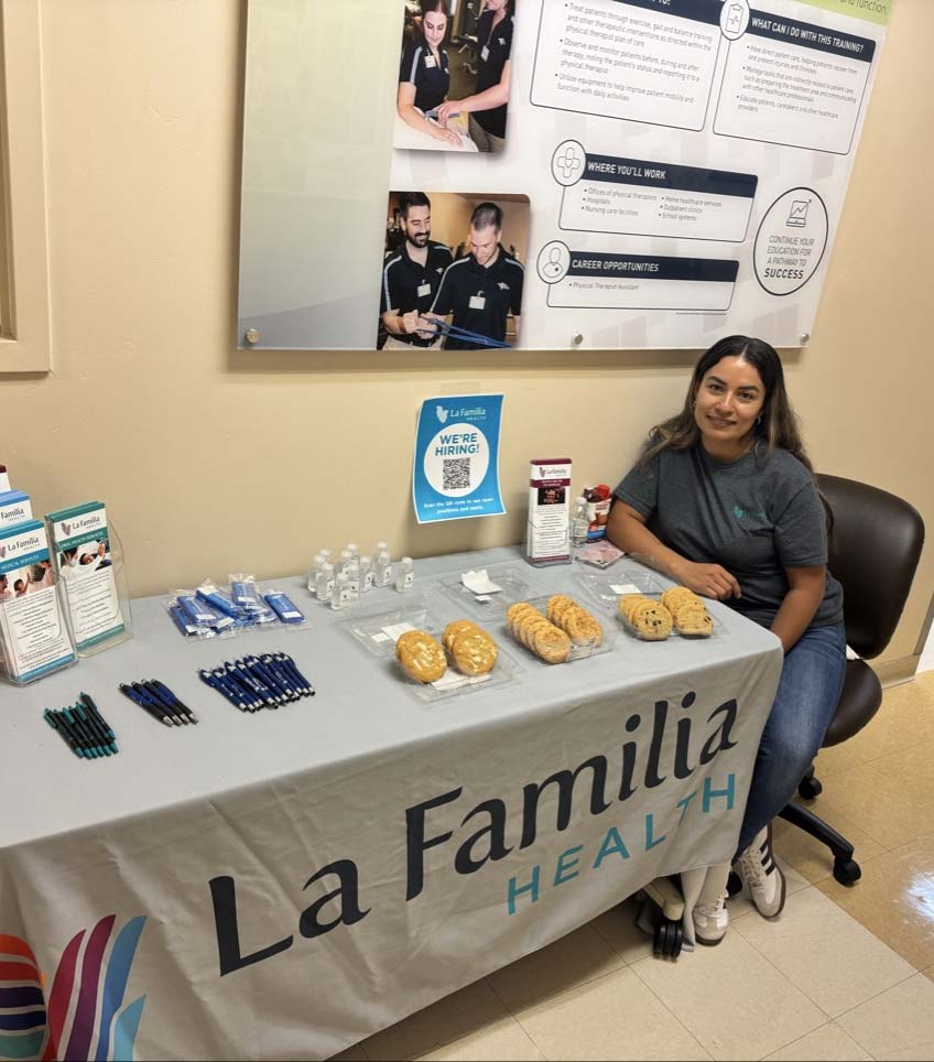 La Familia Health Employee at La Familia Health Table