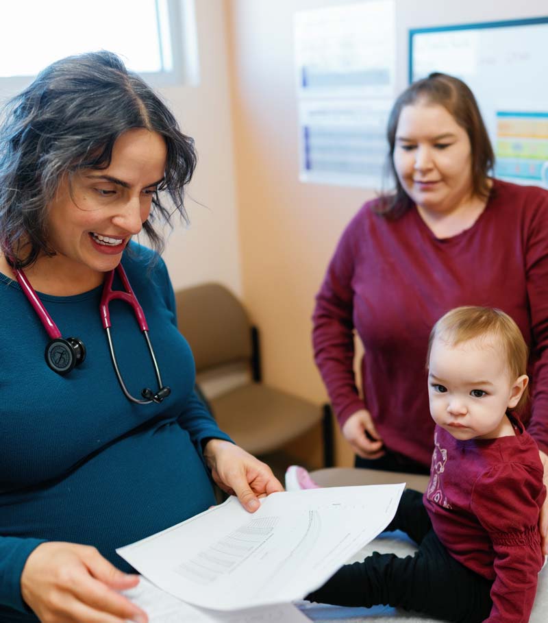 Doctor at La Familia Health with patients