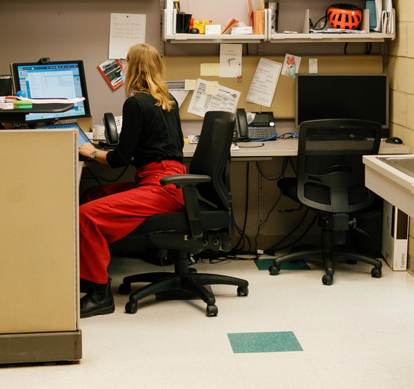 La Familia Staff member at desk