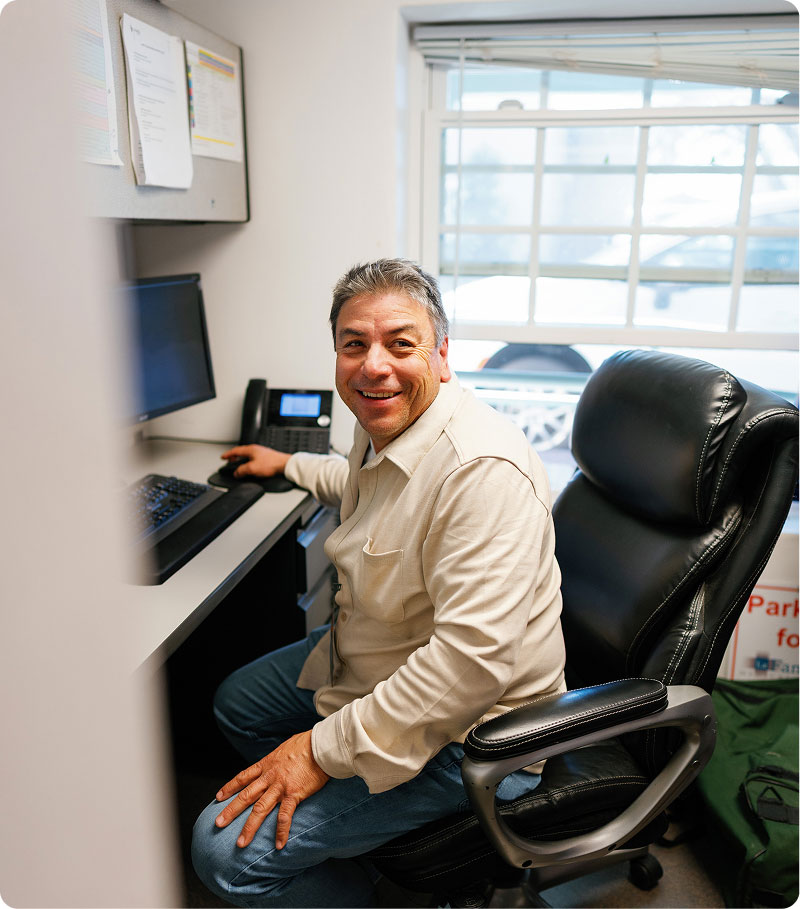 La Familia Staff member at desk