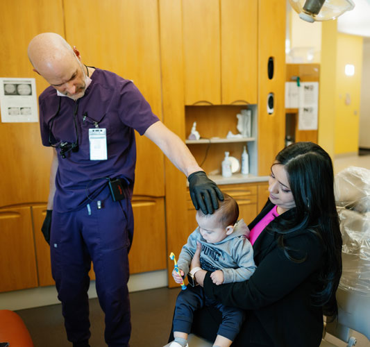 Dentist and dental patients at La Familia Health
