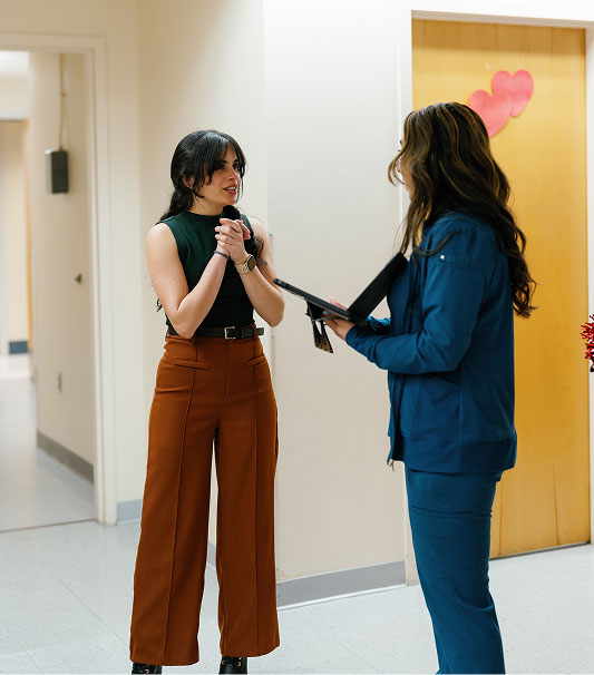 La Familia Health staff talking